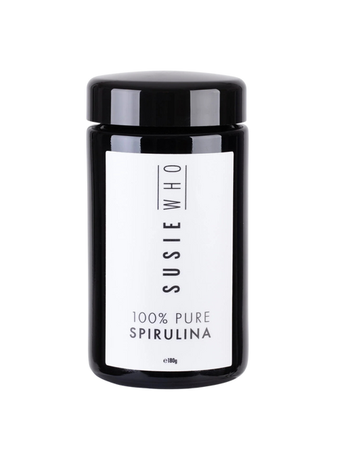 Black container of Susie Who 100% Pure Spirulina on a white background